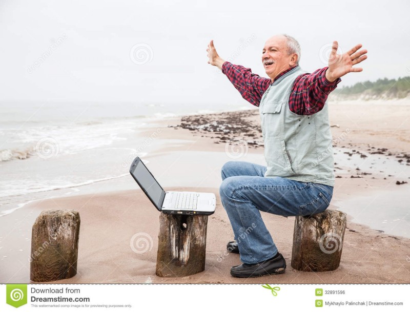 old-man-notebook-beach-happy-laptop-foggy-day-32891596.jpg