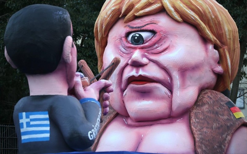 aleksis-tsipras-kai-agkela-merkel-protagonistoun-se-germaniko-karnabali.jpg